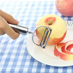 Hand peeling an apple with the stainless steel peeler