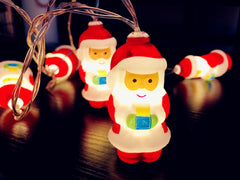 Close-up of a glowing Santa string light