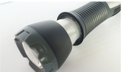 Flashlight head and textured grip, close-up