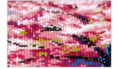 Close-up of resin drills on a diamond painting canvas