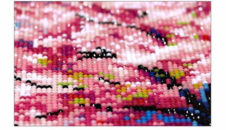 Close-up of resin drills on a diamond painting canvas