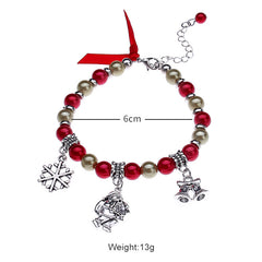 Christmas charm bracelet with red and champagne beads, Santa, snowflake and bell charms