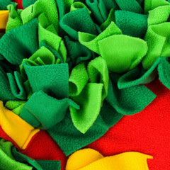 Close-up of the snuffle mat's green fabric strips