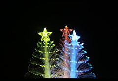 Fibre optic trees with yellow and red stars