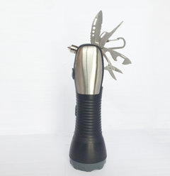 Flashlight standing upright with tools folded out