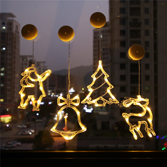 LED Christmas window lights in a city window at night
