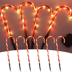 Glowing candy cane stake lights, close-up