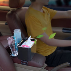 Car organiser box between the front seats holding tissues and a drink