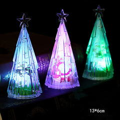 Clear cone tree decorations lit in different colours
