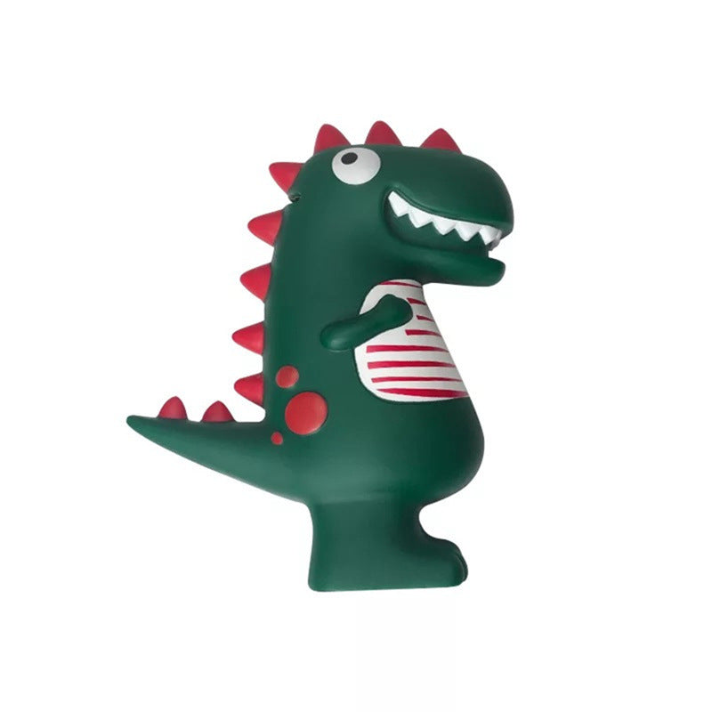 Green dinosaur piggy bank with red spikes and striped shirt, side view