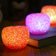 Orange and pink light-up apples glowing