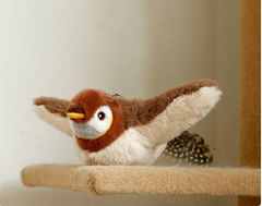 Plush sparrow toy on a cat tree