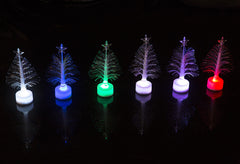 Row of six fibre optic trees in different colours