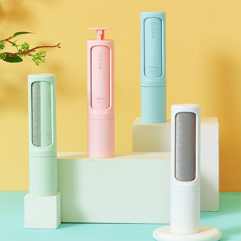 Plastic pet hair lint brushes in green, pink, blue and white